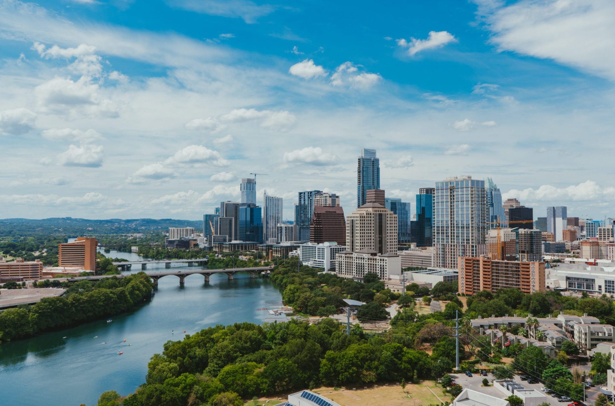 a large body of water with a city in the background