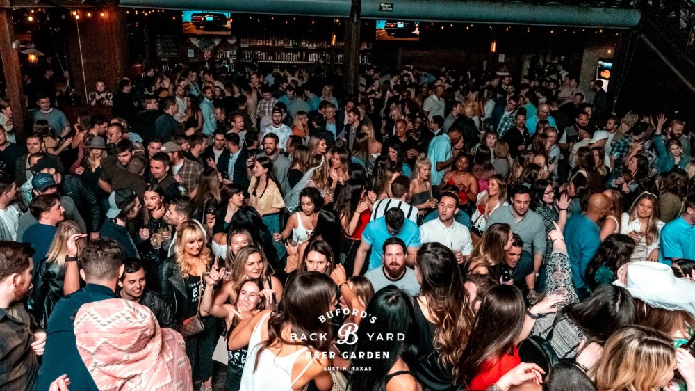 a group of people on a stage in front of a crowd