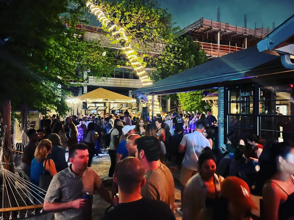 a group of people standing in front of a crowd